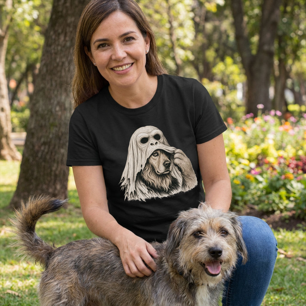Woman wearing a black crewneck t-shirt featuring a graphic of a dog pulling off an ape mask in a park setting.
