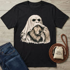 Black cotton t-shirt featuring a dog pulling off an ape mask, with a dog treat bag and leash on a wooden background.