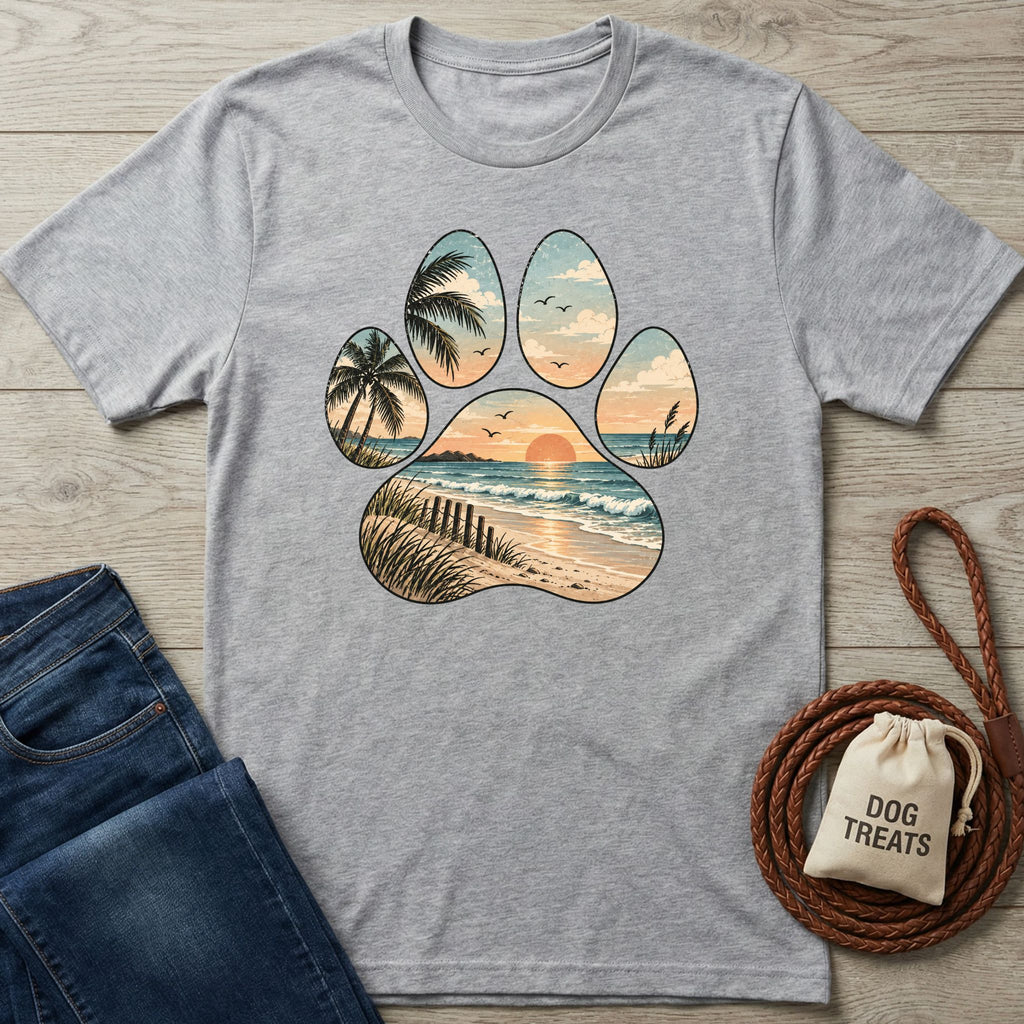 Grey crewneck t-shirt featuring a paw print graphic with a sunset beach, palm trees, and ocean waves design.