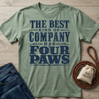 Sage green cotton t-shirt with vintage navy text reading The Best Kind Of Company Has Four Paws, laid on a wooden surface.