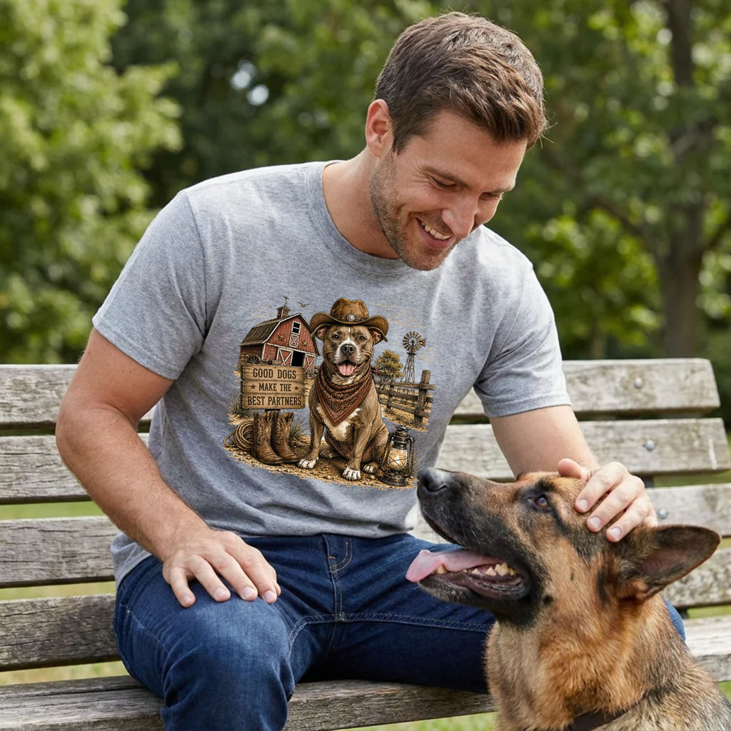 Man wearing a grey crewneck t-shirt featuring a western-style farm dog graphic with a cowboy hat, barn, and lantern.