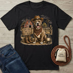 Black crewneck t-shirt featuring a pit bull in a cowboy hat and bandana, standing before a rustic barn and windmill.
