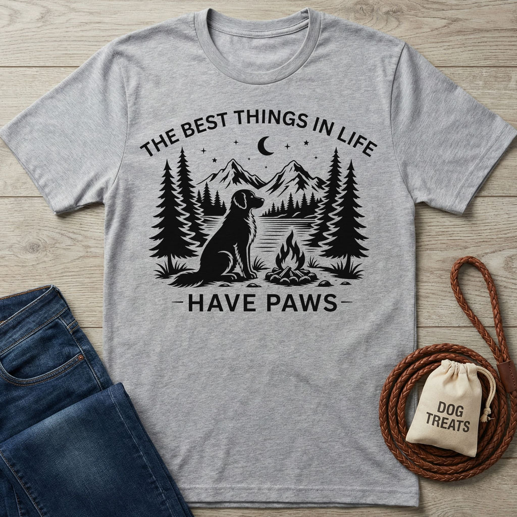 Grey crewneck t-shirt featuring a black graphic of a dog, campfire, and mountains with the text The Best Things In Life Have Paws.