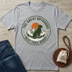 Heather grey crewneck t-shirt featuring a vintage-style graphic of a dog, mountains, and the text The Great Outdoors Best Trail Buddy.