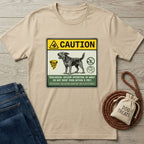 Tan Gildan Softstyle t-shirt with a "Caution: Biological Vacuum" dog design, next to jeans and dog treats.