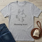Light grey Gildan Softstyle® t-shirt with a black line art dog and "blooming heart" text.