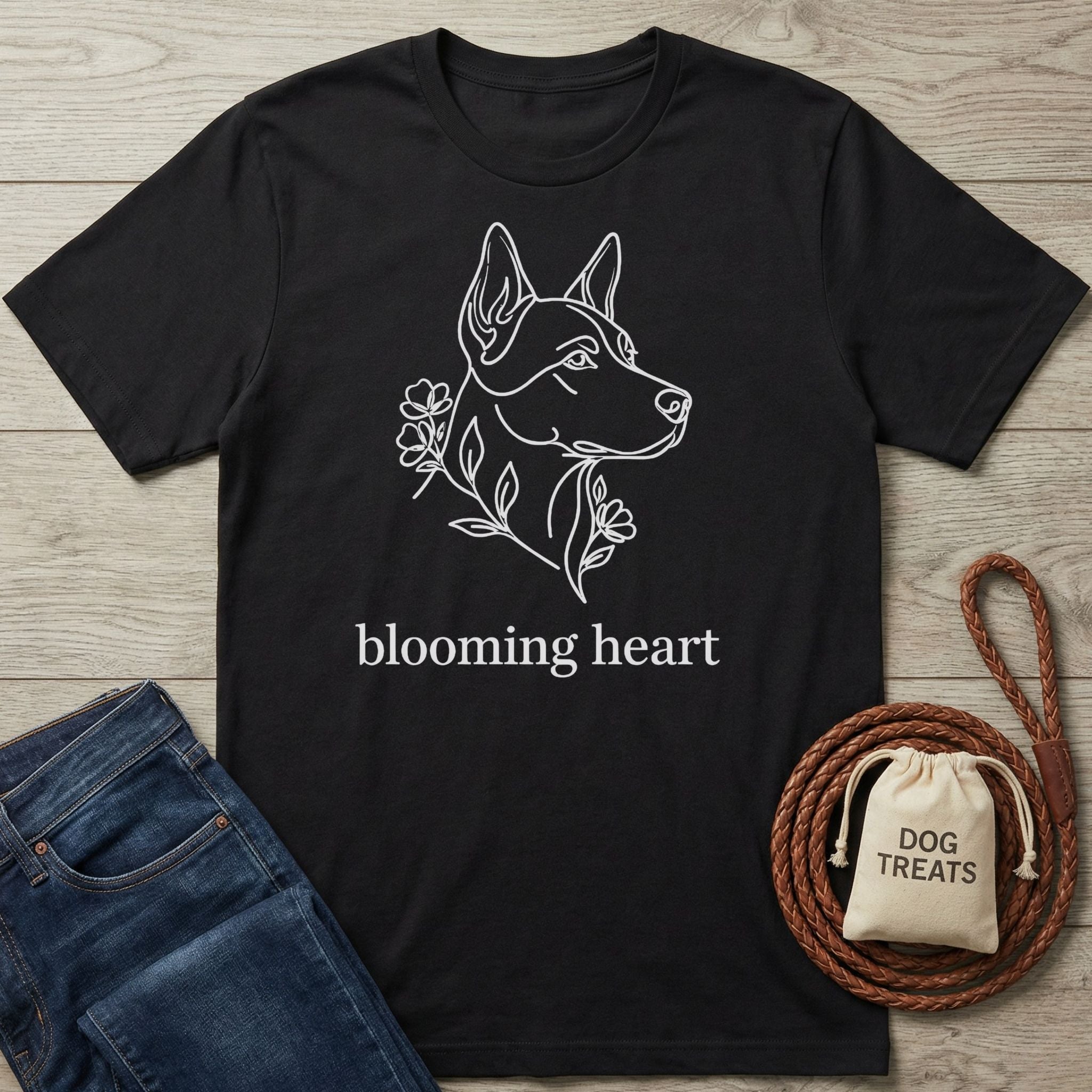 Black Gildan Softstyle® t-shirt with a white line art dog head and "blooming heart" text.