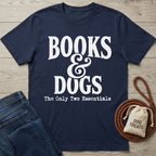 Navy blue cotton T-shirt featuring white Books & Dogs text, styled with denim jeans and a dog treat bag on a wood background.