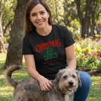 Woman wearing a black crewneck T-shirt with red and white vintage-style Christmas and Dogs graphic text.