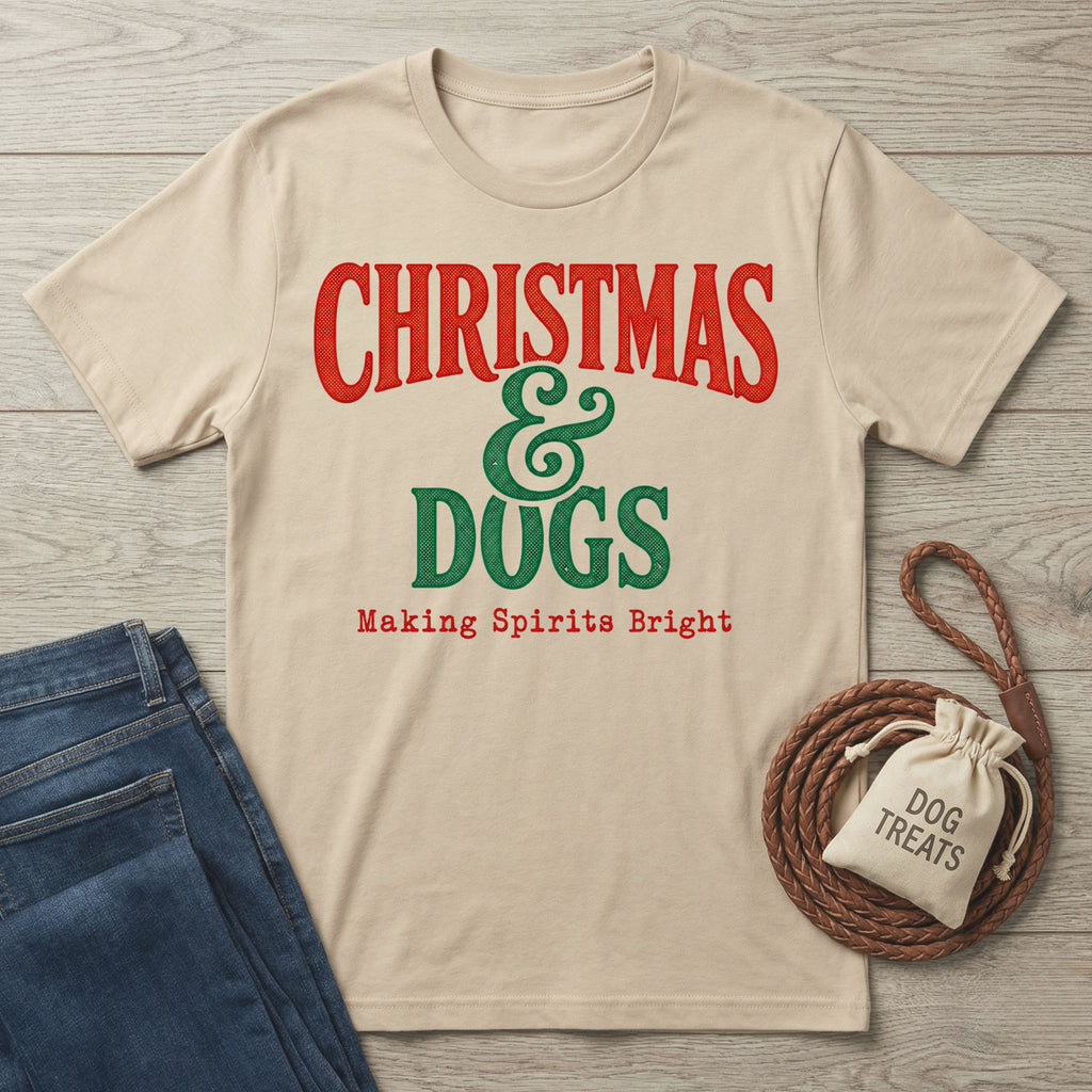 Beige crewneck T-shirt with vintage-style red and green Christmas and Dogs graphic on a wooden background.