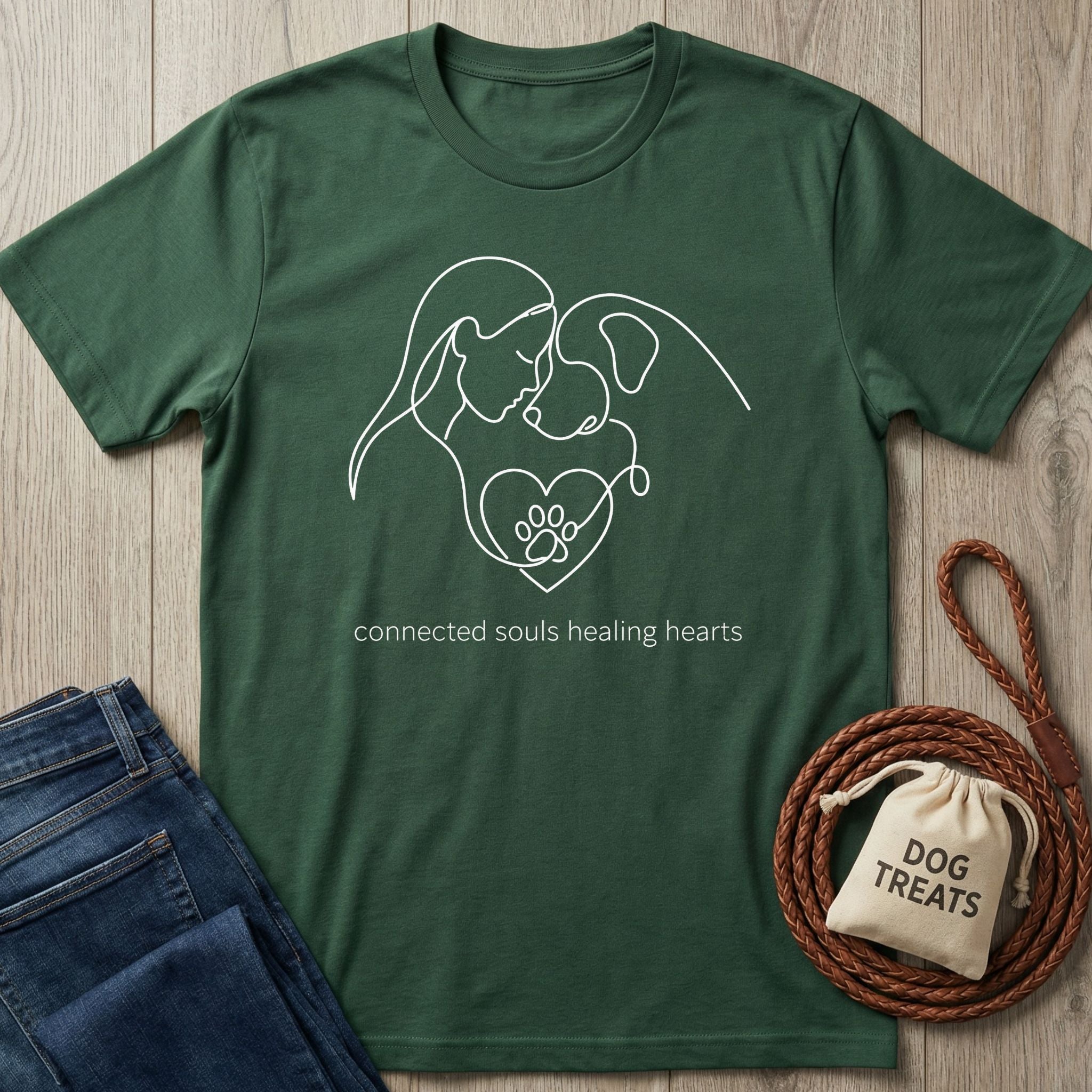 Dark green Gildan Softstyle t-shirt with a white line art design of a person, dog, and heart with paw print.