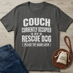 Dark grey Gildan Softstyle t-shirt with "THE COUCH IS CURRENTLY OCCUPIED BY A RESCUE DOG..." text.