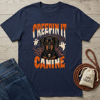 Navy blue t-shirt featuring a Dachshund graphic with ghosts, spiderwebs, and the text Creepin It Canine in orange.