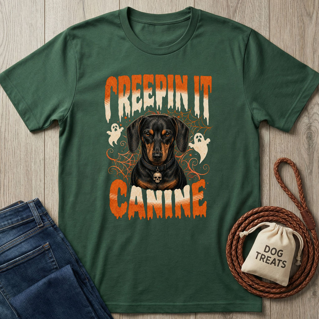 Forest green crewneck t-shirt featuring a Dachshund graphic with ghosts, spiderwebs, and Creepin It Canine text.