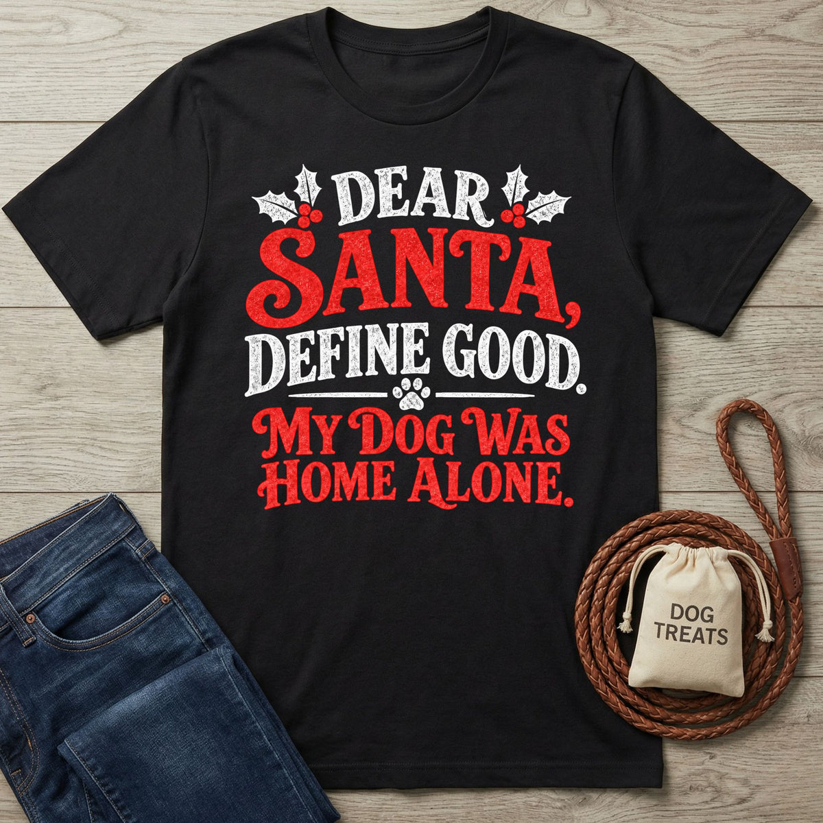Black crewneck T-shirt featuring festive red and white text that reads Dear Santa, Define Good, My Dog Was Home Alone.