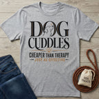Grey crewneck t-shirt featuring Dog Cuddles Cheaper Than Therapy text, a dog illustration, and a paw print graphic.