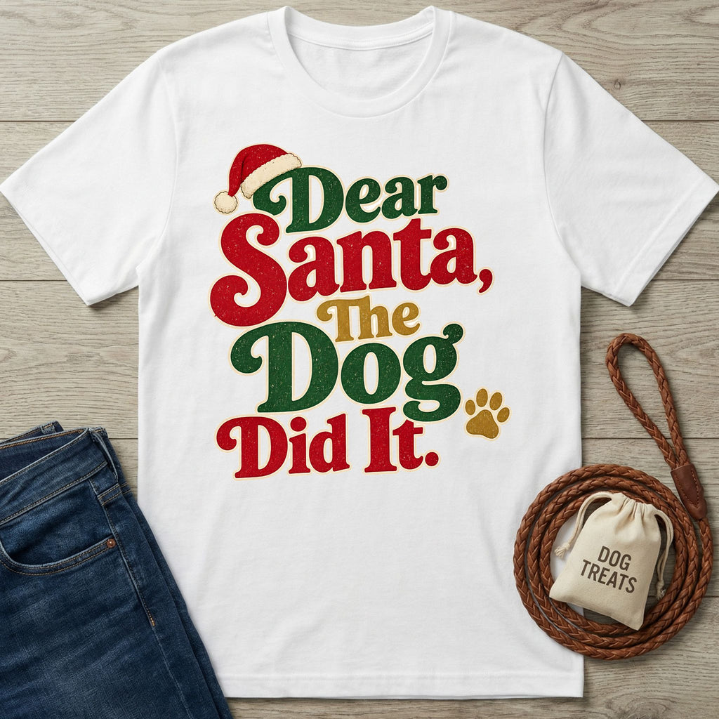 White crewneck t-shirt with festive red, green, and gold Dear Santa The Dog Did It text and a Santa hat graphic.