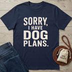 Navy blue crewneck t-shirt with distressed white text reading Sorry, I Have Dog Plans, laid on a wooden background.