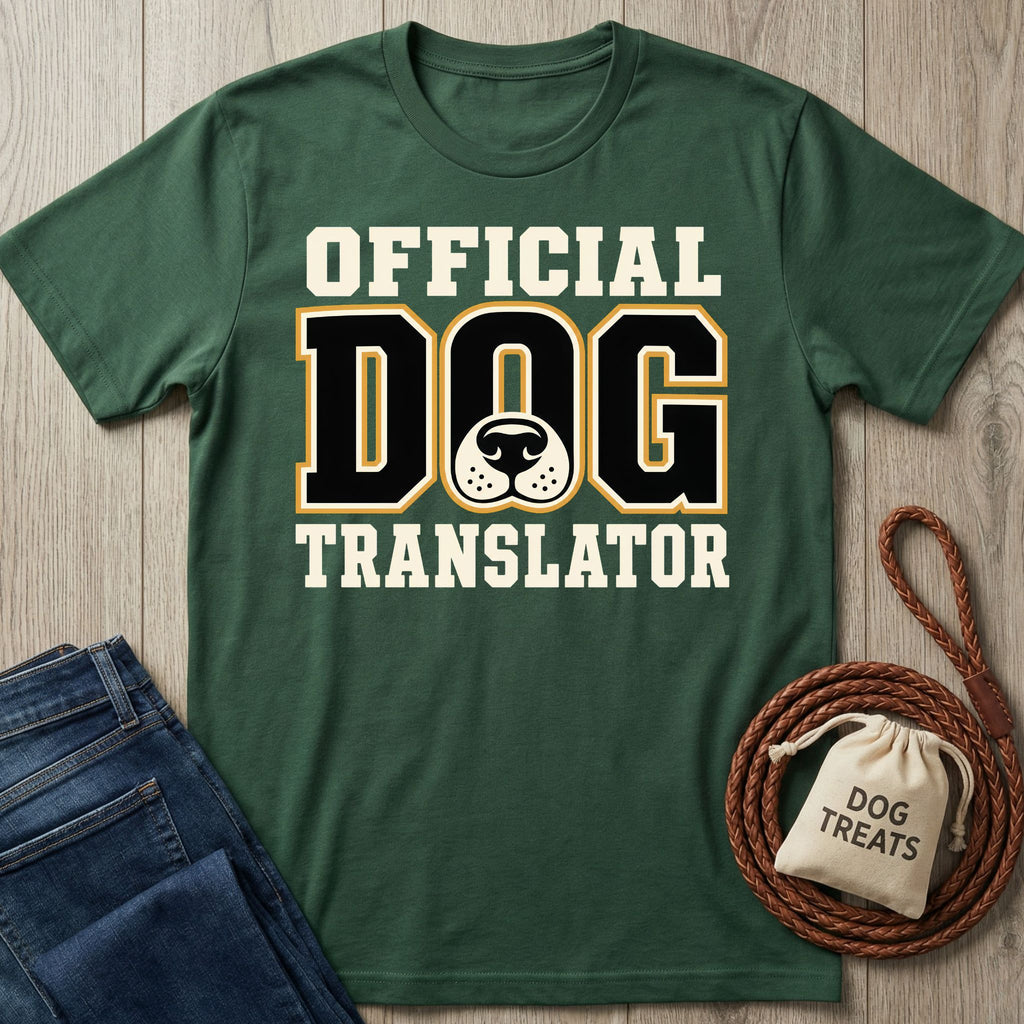 Forest green crew neck t-shirt with Official Dog Translator text and a dog nose graphic, displayed with a leash and treat bag.