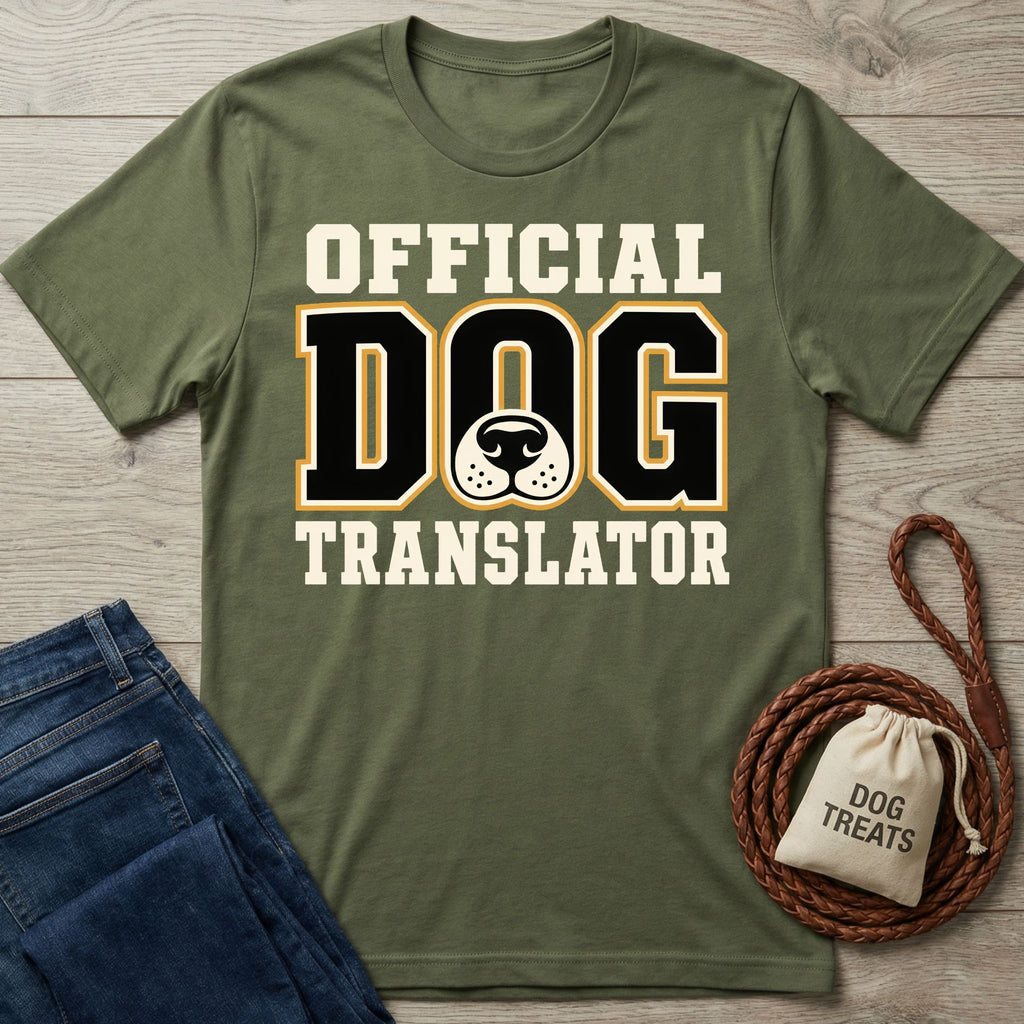 Olive green crewneck t-shirt featuring Official Dog Translator text and a dog nose graphic, displayed with jeans and a treat bag.