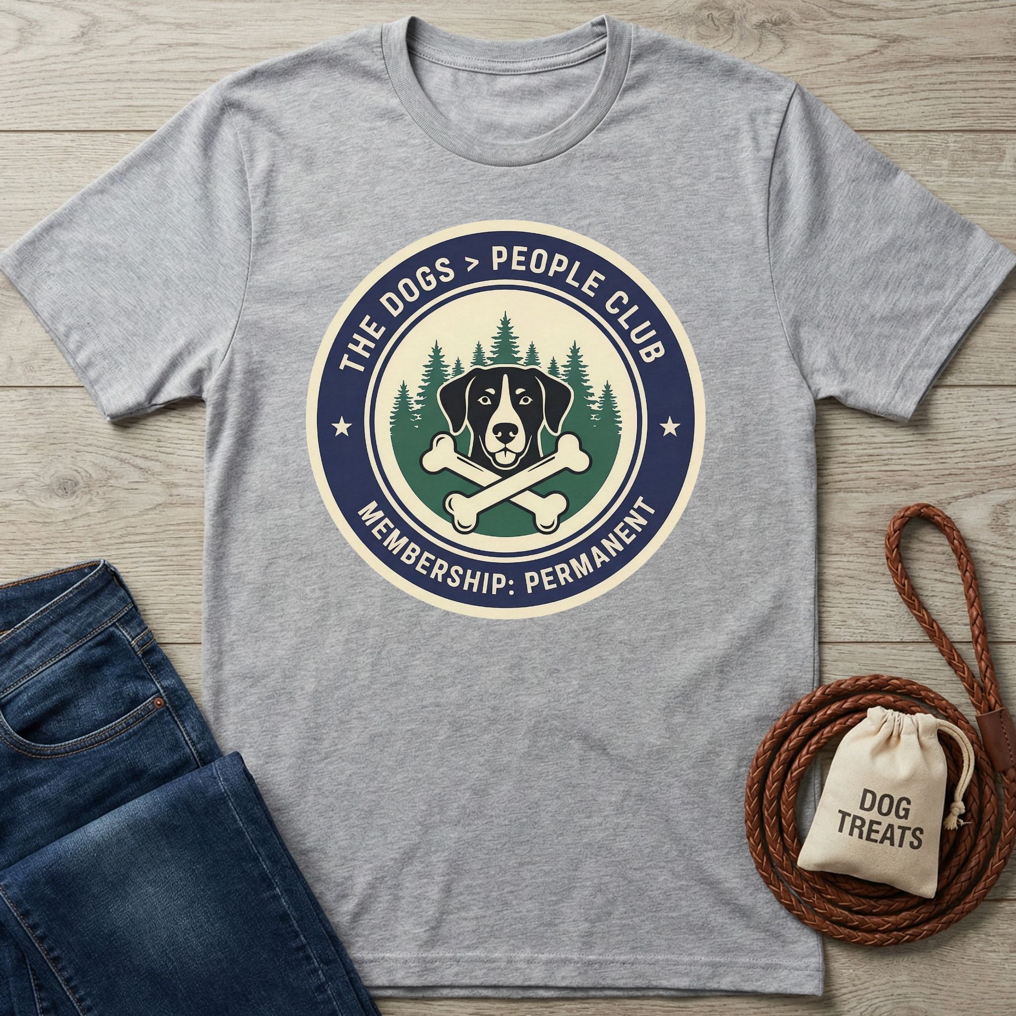 Light grey Gildan Softstyle t-shirt with "The Dogs > People Club" graphic, jeans, and dog accessories.