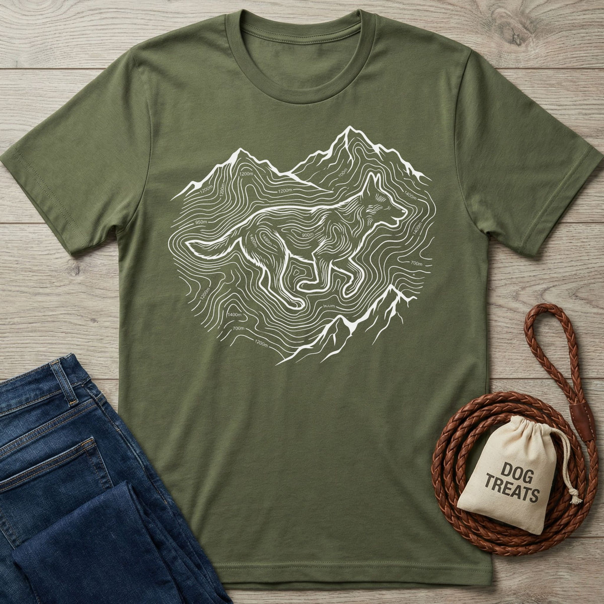 Olive green Gildan Softstyle t-shirt with white elevation lines forming mountains and a running dog design.