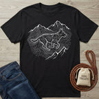 Black Gildan Softstyle® t-shirt with white contour line design of a running dog and mountains.