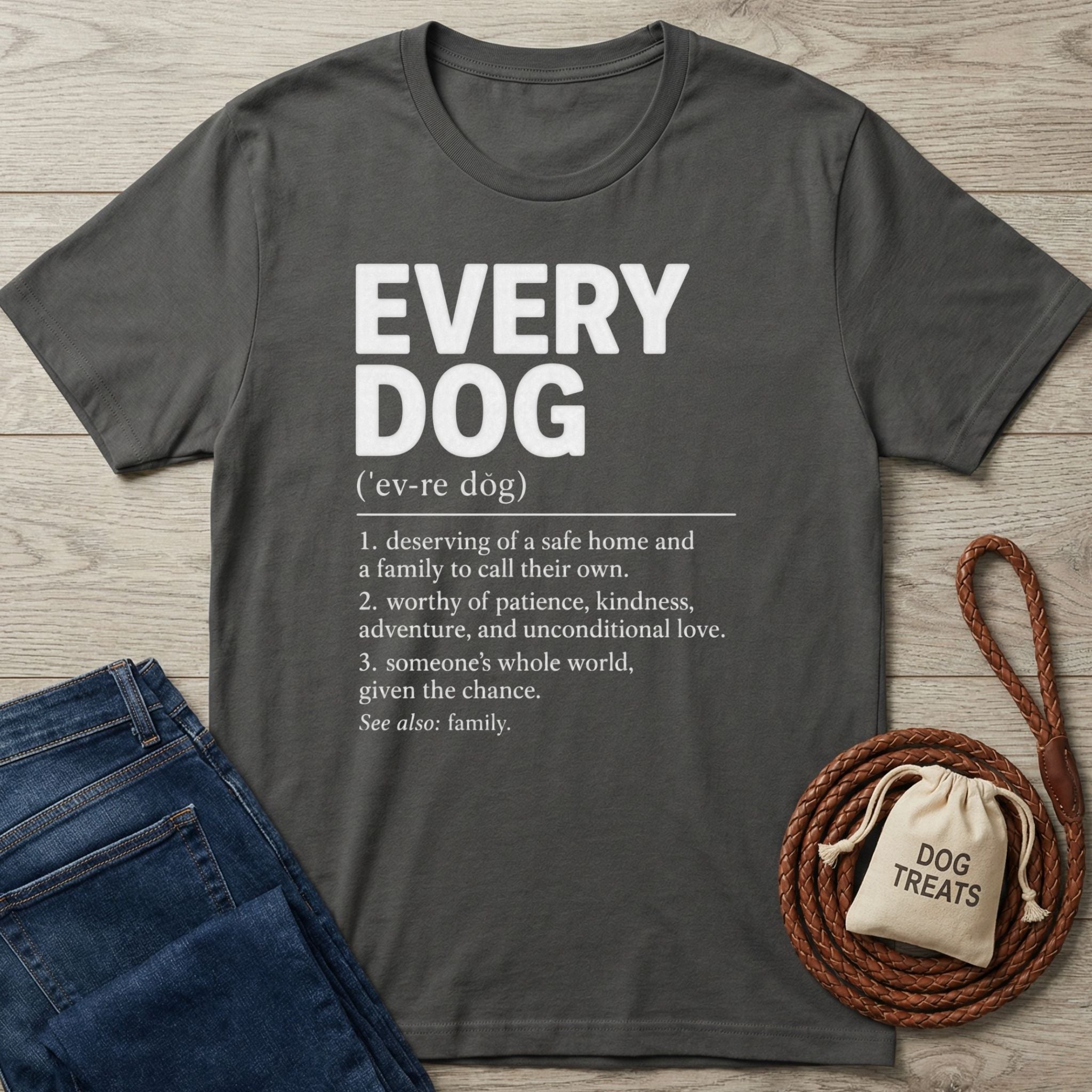 Charcoal gray crewneck t-shirt featuring a white dictionary-style definition of "Every Dog" printed on the front.