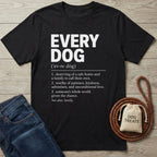 Black cotton t-shirt with white Every Dog definition graphic, displayed with blue jeans, a leather leash, and a treat bag.