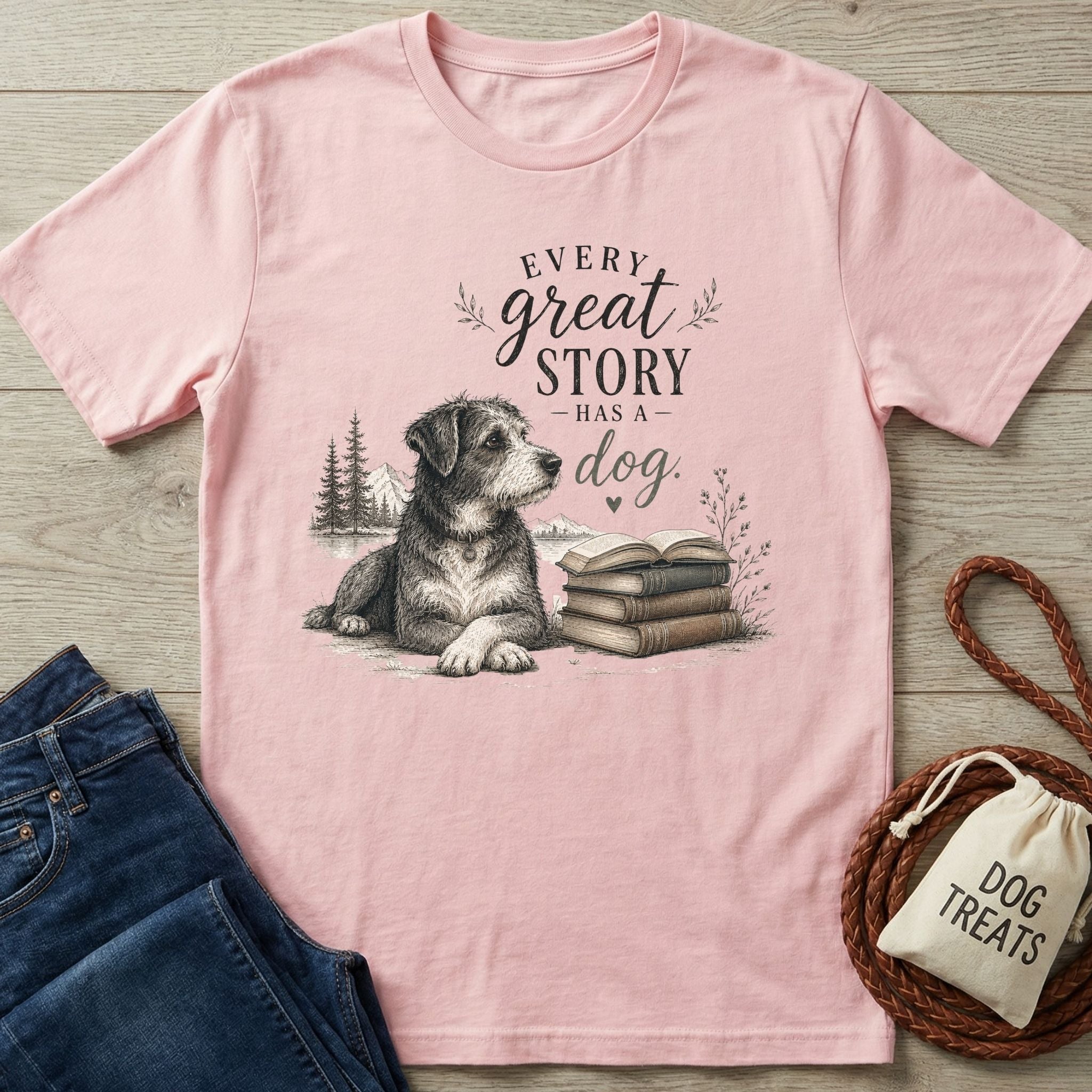 Soft pink crewneck t-shirt featuring a sketch of a dog next to a stack of books and the text Every Great Story Has A Dog.