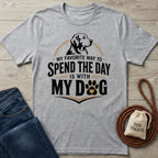 Grey crewneck t-shirt featuring a dog illustration and the text My Favorite Way To Spend The Day Is With My Dog.