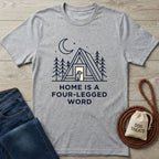 Light grey Gildan Softstyle® t-shirt with "Home is a Four-Legged Word" graphic, featuring a dog in an A-frame cabin.