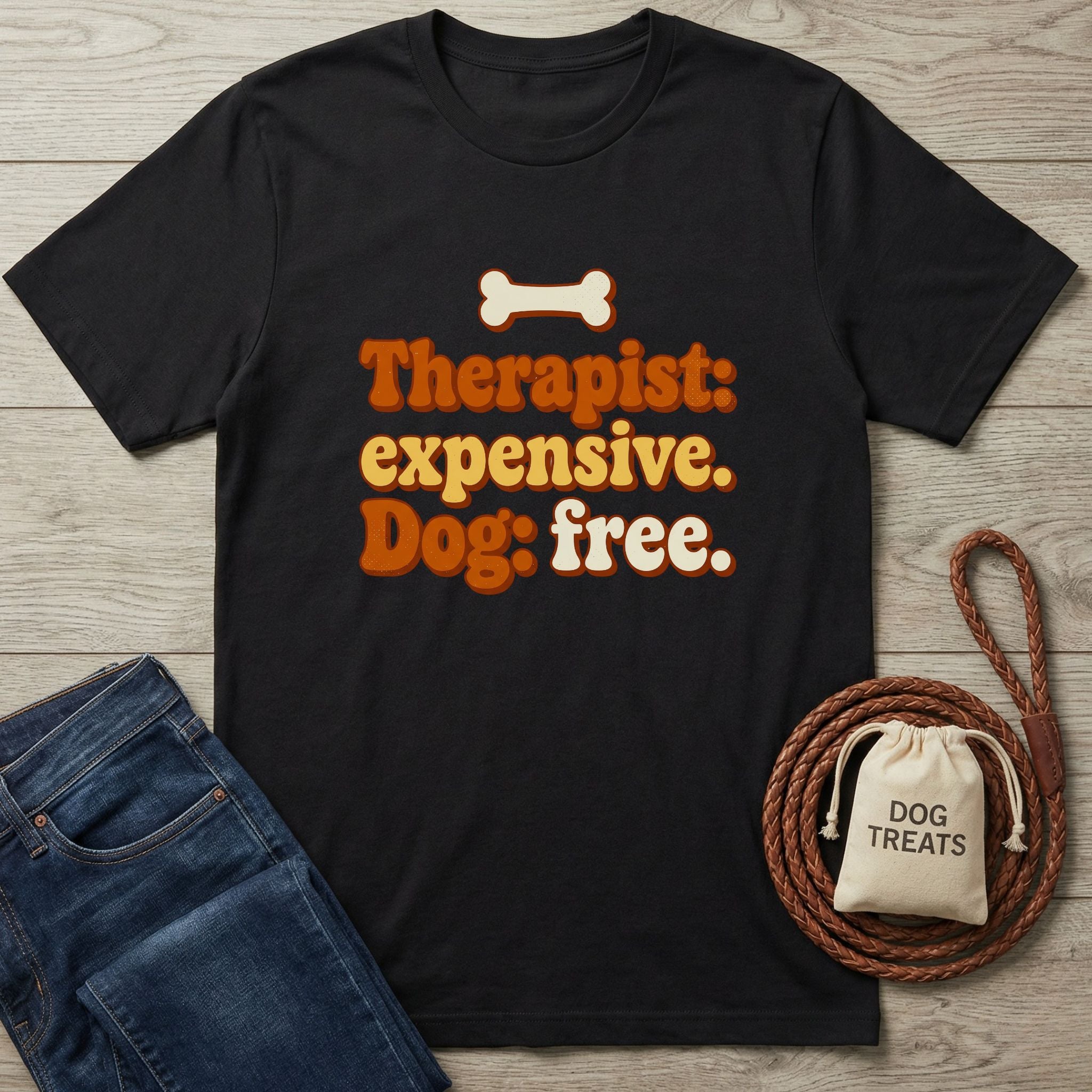 Black Gildan Softstyle® t-shirt with "Therapist: expensive. Dog: free." text and a bone graphic.