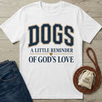 White crewneck t-shirt featuring navy and gold collegiate-style text reading Dogs: A Little Reminder of God's Love.