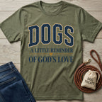 Olive green crewneck t-shirt featuring the text Dogs: A Little Reminder of God's Love with a small heart icon.