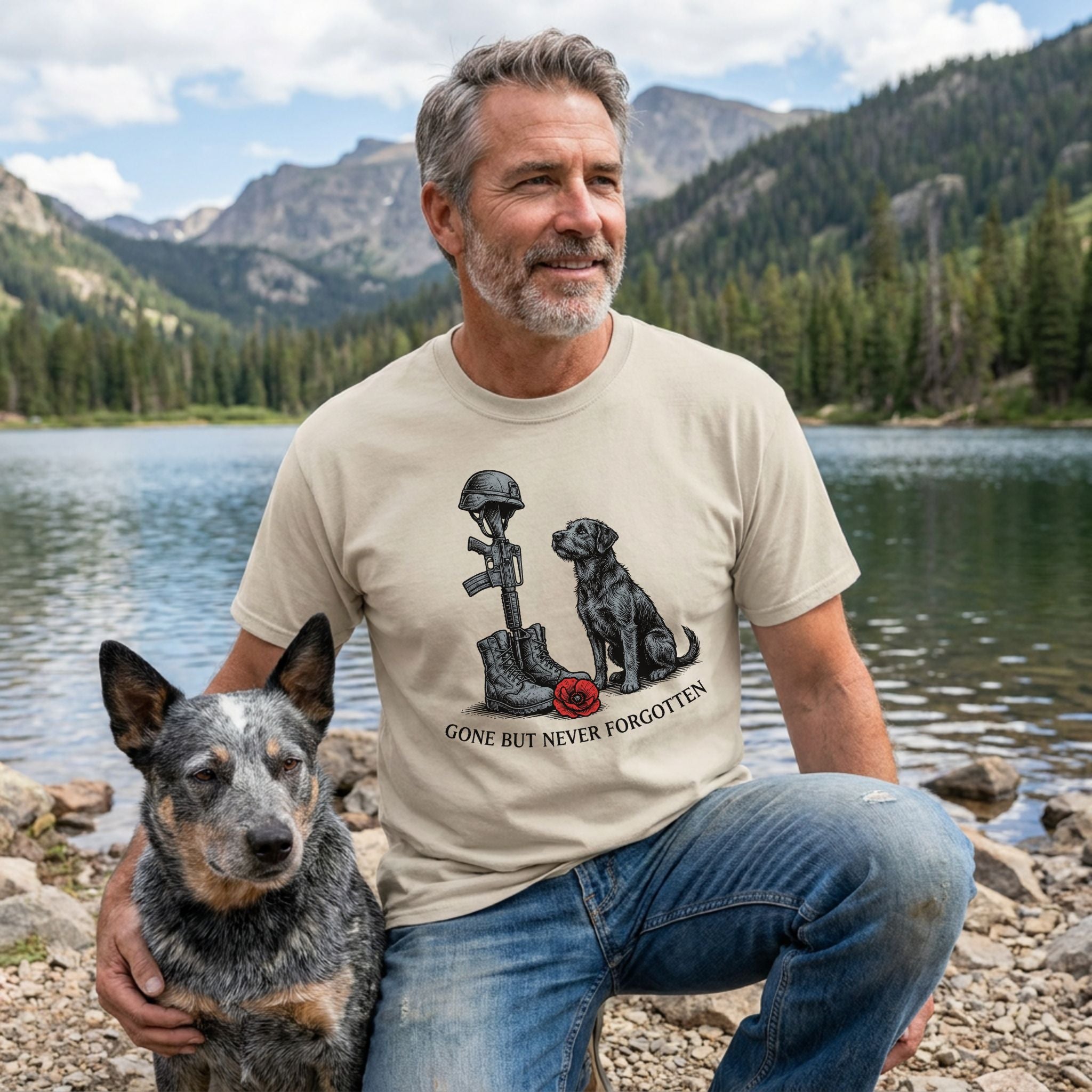 Man in a beige "Gone But Never Forgotten" t-shirt with a soldier's cross and black dog, next to a blue heeler.