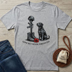 Light grey Gildan Softstyle® t-shirt with a "Gone But Never Forgotten" graphic featuring a black dog, soldier's boots, rifle, helmet, and a red poppy.