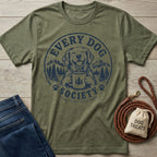Olive green crewneck t-shirt featuring a navy blue graphic of a dog holding a coffee mug in a mountain forest setting.