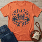 Burnt orange crewneck t-shirt featuring a navy blue graphic of a happy dog holding a coffee mug in a mountain landscape.