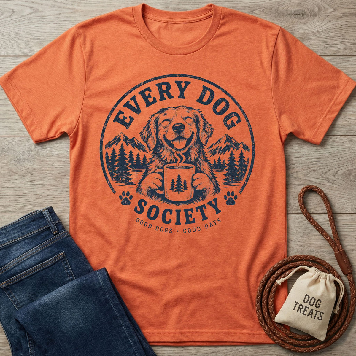 Burnt orange crewneck t-shirt featuring a navy blue graphic of a happy dog holding a coffee mug in a mountain landscape.