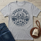 Grey crewneck t-shirt featuring a navy Every Dog Society graphic of a happy dog holding a coffee mug in a mountain forest.