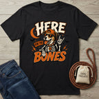 Black cotton t-shirt featuring a cool dog in a skeleton costume, sunglasses, and cap with the text Here For The Bones.