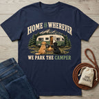 Navy blue crewneck t-shirt featuring a vintage camper, campfire, and two dogs with the text Home Is Wherever We Park The Camper.