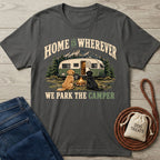 Charcoal grey t-shirt featuring a vintage camper, campfire, and two dogs with the text Home Is Wherever We Park The Camper.