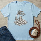 Light blue cotton t-shirt featuring a sketch of a dog in a hat relaxing on a beach towel under a palm tree.