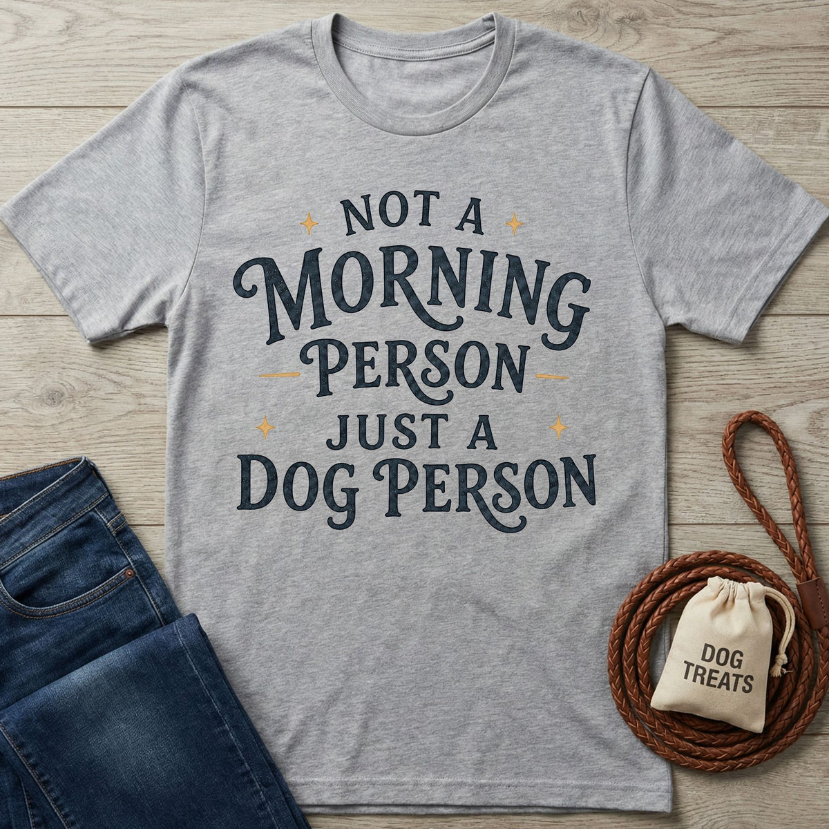 Grey crewneck t-shirt featuring the text Not A Morning Person Just A Dog Person in dark blue vintage-style lettering.