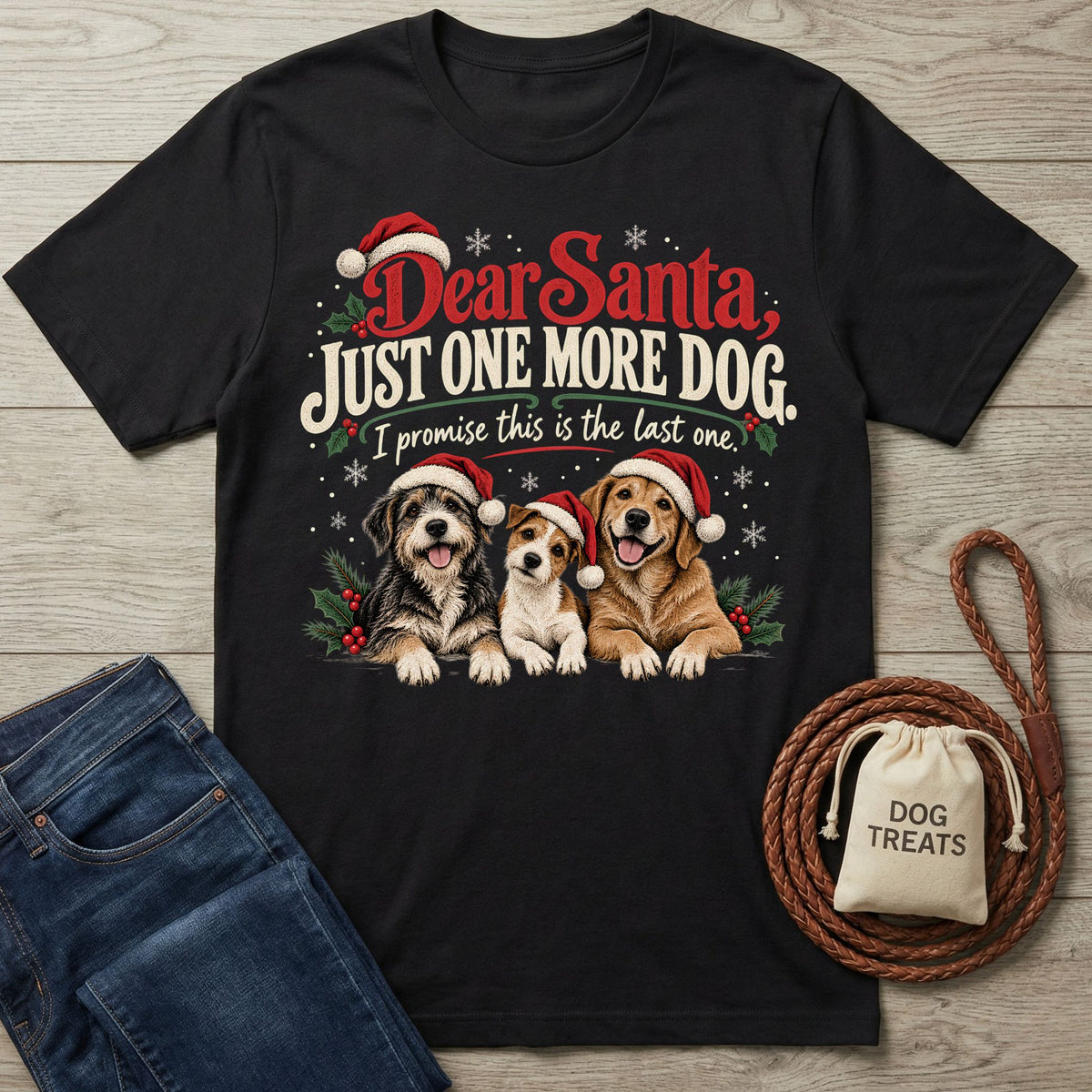 Black cotton T-shirt featuring three dogs in Santa hats with the text Dear Santa, Just One More Dog.
