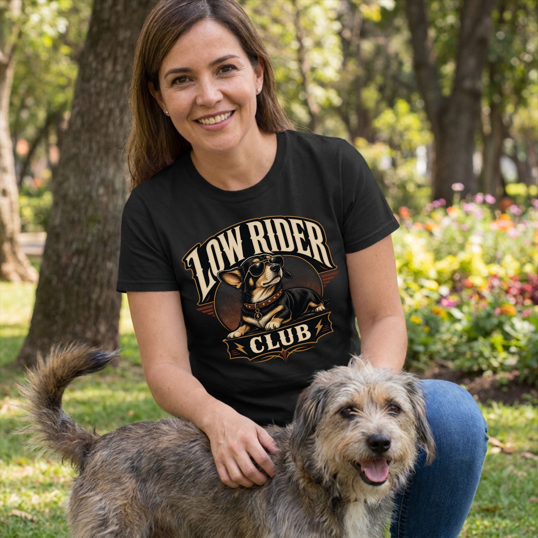 Woman wearing a black crewneck t-shirt featuring a graphic of a dog in sunglasses with the text Low Rider Club.