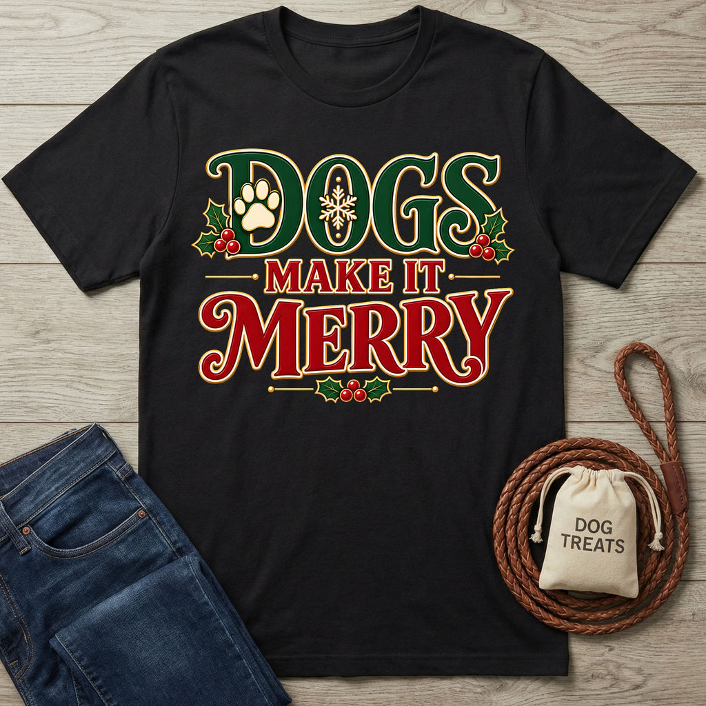Black crewneck T-shirt with vintage-style Christmas lettering, holly, and paw print graphics, displayed on a wooden surface.