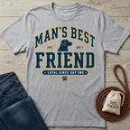 Grey crewneck t-shirt featuring a Man's Best Friend dog graphic with navy and gold lettering on a wooden background.